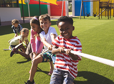 group of kids playing tug of war